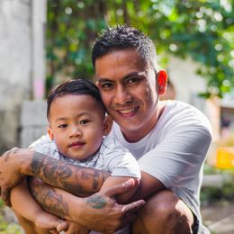 A father hugging his son