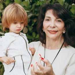 A grandmother holding her grandson